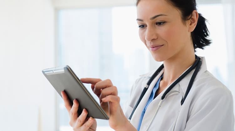 Female Doctor using Tablet
