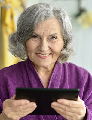 Portrait of  Old woman  with tablet pc